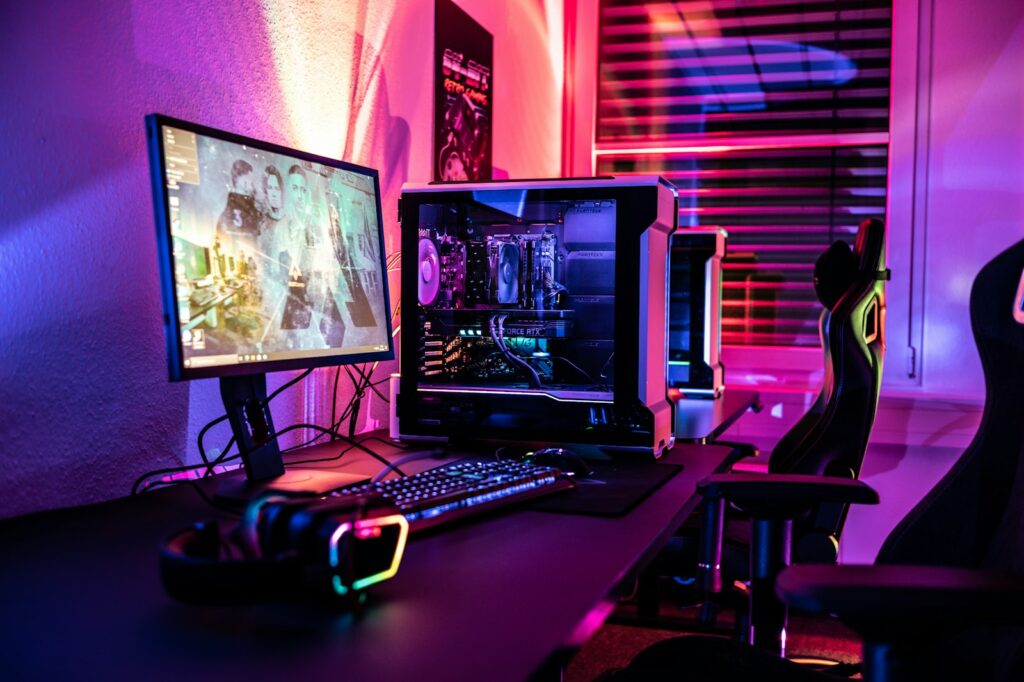 Gaming desk with monitor, keyboard, and mouse